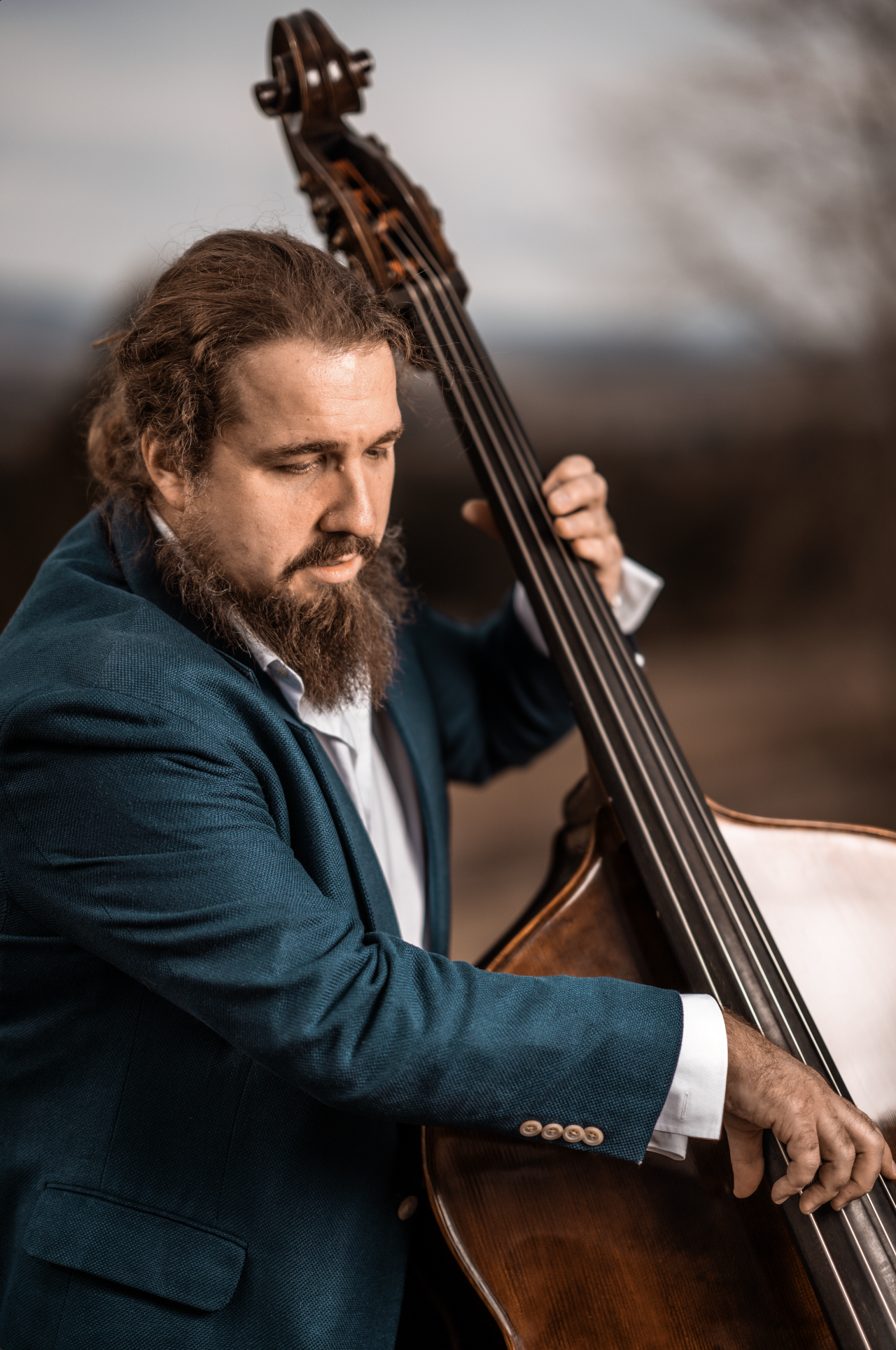 Lee Whalen holding upright bass